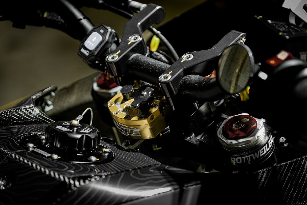 close view of top triple clamp and top of fork legs