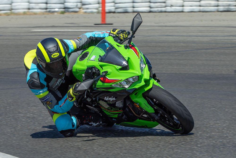 2023 Kawasaki ZX-4RR leaning right through a corner at a race track.
